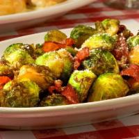 Brussels Sprouts & Prosciutto · 
Crispy Brussels sprouts sautéed with prosciutto & parmesan cheese