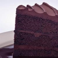 Double Dark Chocolate Cake · Moist dark chocolate cake with layers of rich chocolate frosting on top of our sinful chocol...