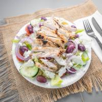 Greek Salad · Iceberg and romaine lettuce, tomatoes, onions, green peppers, red cabbage, cucumbers, and ca...