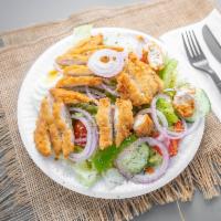Chicken Finger Salad · Iceberg and romaine lettuce, tomatoes, onions, green peppers, red cabbage, cucumbers, and ca...