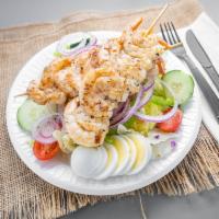 Grilled Shrimp Salad · Iceberg and romaine lettuce, tomatoes, onions, green peppers, red cabbage, cucumbers, and ca...