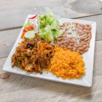 Bistec Encebollado · Tender steak with sautéed onions, jalapeños, tomate sauce, served with yellow rice, refried ...