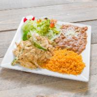 Pollo en Crema · Sauteed seasoned chicken breast tossed in a creamy sauce served with yellow rice, refried be...
