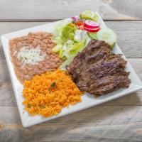 Carne Asada · Tender grilled steak served with yellow rice, refried beans, salad and hand made tortillas.