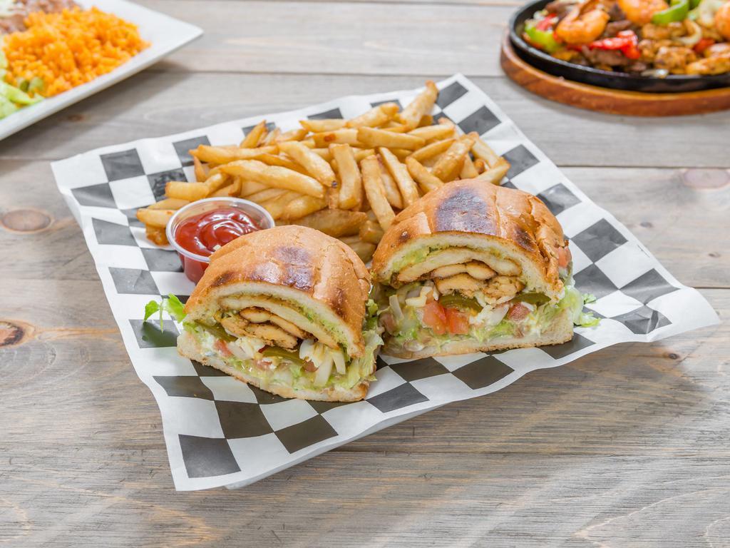 Tortas · Mexican sandwich with mayonnaise, refried beans, cheese, tomatoes, onions, guacamole, lettuce, jalapeños, French fries, and your choice of meat.