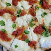 St. Margherita Pizza · Tomato, basil, fresh mozzarella.
All pizzas 14