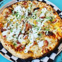 Central Gwizz · Pierogi-style pizza. Seasoned oil, kielbasa, mashed potatoes, bacon bits, cheddar cheese, an...