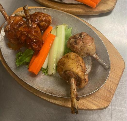 Smoked & Fried Drumstick Lollipops · (5) DRUMSTICK LOLLIPOPS SERVED WITH A SIDE OF CARROTS & CELERY WITH RANCH OR BLUE CHEESE. THIS ITEM IS GLUTEN FREE.