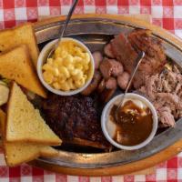 Sampler Platter · BUILT TO SHARE. ALL FOUR MEATS AND ANY TWO SIDES WITH TEXAS TOAST. THIS ENTREE IS GLUTEN FRE...
