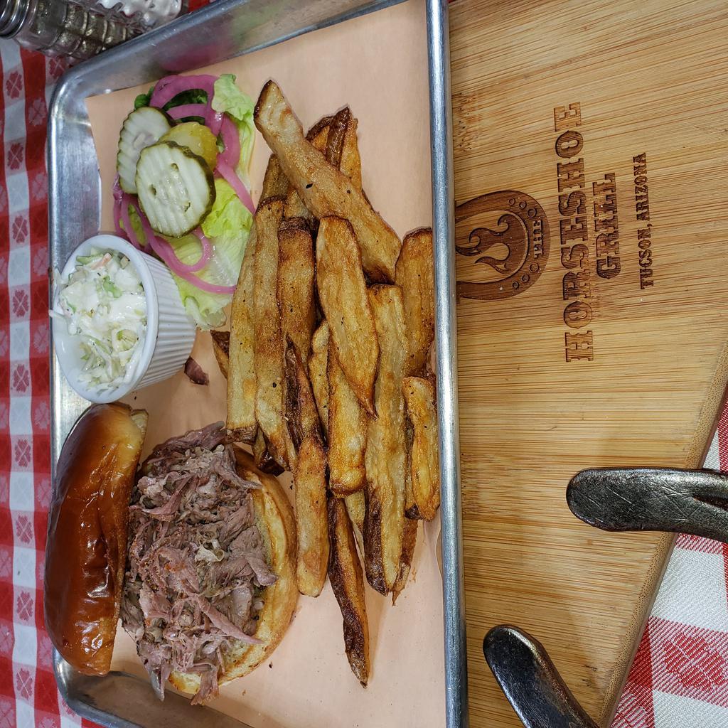 Slow Smoked Pulled Pork Sandwich · WITH APPLE COLESLAW AND ORIGINAL BBQ SAUCE ON A TOASTED BUN. INCLUDES FRESH-CUT FRIES, SUB AND SIDE FOR 1.99. THIS ENTREE IS GLUTEN FREE WHEN YOU ADD A G.F. BUN AND CHOOSE G.F. SIDES