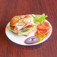 Turkey Sandwich Lunch · Your choice of croissant or bagel. Sandwich include Tomato, lettuce, pickle, onion. Dressing...