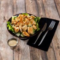 Grilled Chicken Caesar Salad  · Green salad with grilled chicken, Caesar dressing and cheese. 