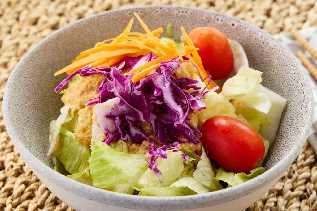 HK  House Salad  · Crisp greens, red cabbage, carrots and grape  tomatoes in a homemade tangy ginger dressing.