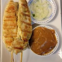 A2. Satay Gai · 4 pieces. Famous Thai appetizer: grilled chicken on skewers served with peanut sauce, and cu...
