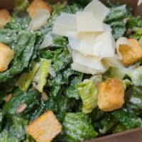 Caesar Salad · Romaine tossed in Parmesan, toasted sunflower seeds, croutons, and Caesar dressing.