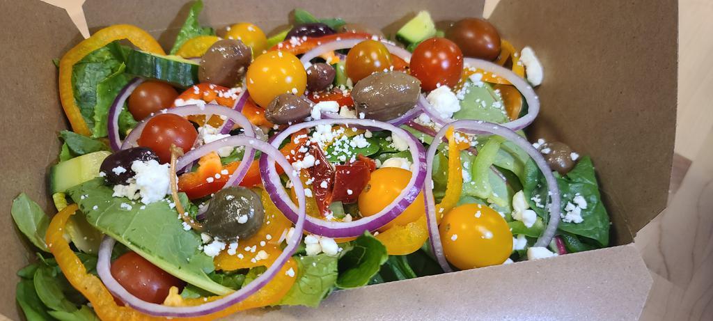 Greek Salad · Romaine, spinach and spring greens with Kalamata olives, sliced bell-pepper triad, English cucumbers, feta crumbles, cherry tomatoes and red onion slices 