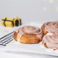 Cinnamon Bun · Tender Danish dough with layers of cinnamon filling, rolled in cinnamon sugar, topped with w...