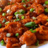 Manchurian Chicken · Chicken stir-fried with green bell peppers, soy sauce, garlic, ginger, green chili, chopped ...