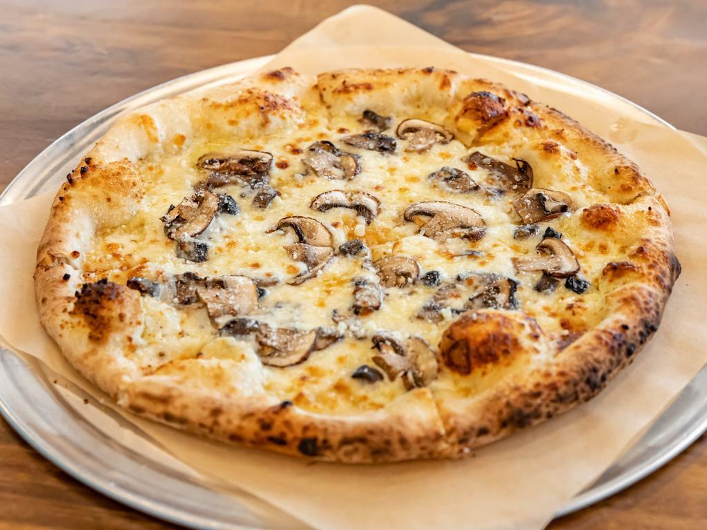 Mushroom and Truffle Pizza · Cremini mushrooms, Gruyere, mozzarella, Parmesan, and truffle oil.
