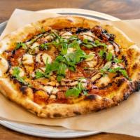 Caponata Pizza · Eggplant, tomato, capers, arugula, balsamic reduction, and mozzarella.