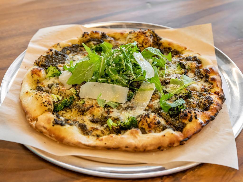 The Green Pizza · Arugula, roasted broccoli, Parmesan, and pesto vinaigrette.