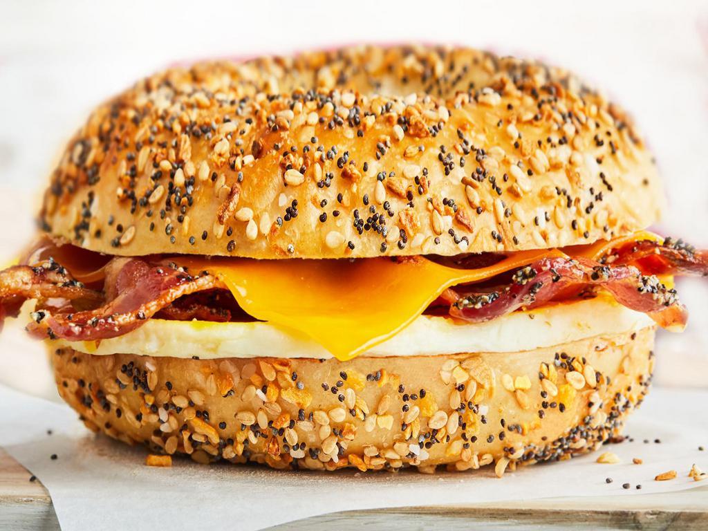 Egg, Peppered Bacon & Cheese · A perfectly seasoned fresh-cracked egg topped with peppered bacon and with your choice of cheese on any one of our authentic New York style bagels.