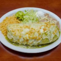 Burrito Dinner Suizo · A giant flour tortilla filled with beans, rice, lettuce, tomatoes, cheese and your choice of...