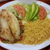 Filete Relleno · Stuffed tilapia filets with grilled veggies and chihuahua cheese. Served with rice, lettuce ...