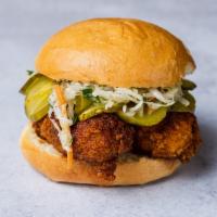 Nashville-Style Hot Chicken Sandwich (MEDIUM HOT) · Medium Hot. Dipped in chili oil with spice rub, coleslaw, and cured pickles