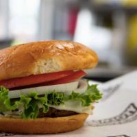 Turkey Burger (All Natural) · Premium ground turkey, topped with Swiss cheese, lettuce, tomato, onions, pickles, and our h...