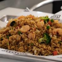 Shrimp Fried Rice · Onions, peas, carrots, broccoli, and large shrimp pieces.
