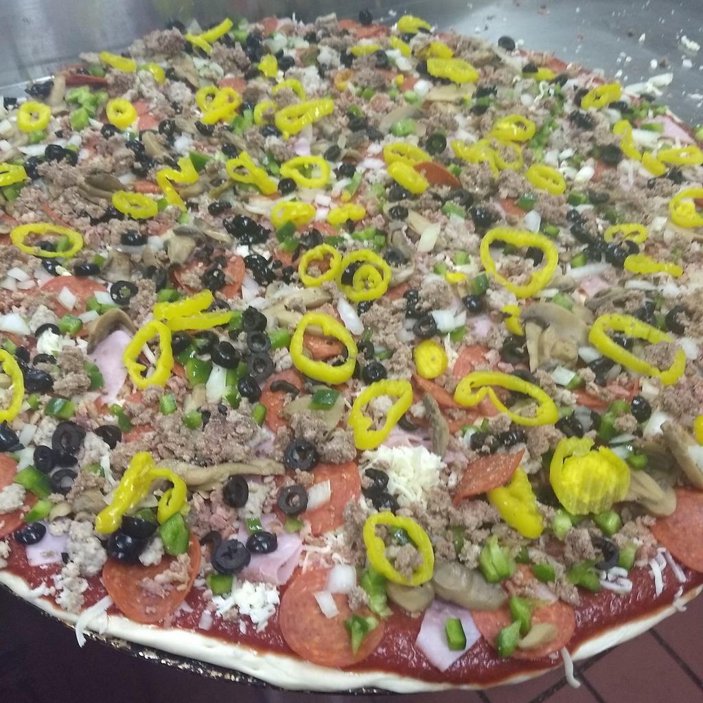 Super Deluxe Pizza · Pizza sauce, mozzarella cheese, ham, pepperoni, mushroom, green pepper, onion, bacon, Italian sausage, black olives, banana peppers, and ground beef.