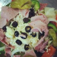 Antipasto Salad · Lettuce, tomatoes, onions, green peppers, black olives, mozzarella, pepperoncini, ham, and s...