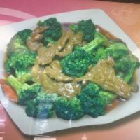 84. Beef with Broccoli · Served with white rice.