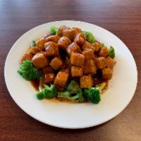 56. General Tso's Bean Curd · Served with white rice. Hot and spicy.