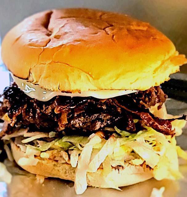 Fried Onion Steak Burger · 1/4 lb patty, chopped steak, provolone cheese, mayo, BBQ sauce, spicy ranch sauce, crispy fried onions, and two slices of bacon