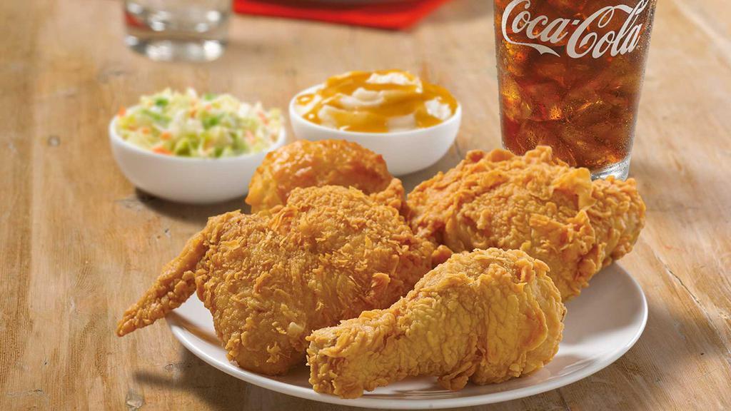 3 Piece Spicy Dark Combo · Three pieces of spicy dark chicken with two regular sides, one Honey-Butter Biscuit™, and a large drink.