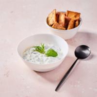 Tzatziki (V) · Includes a free side of pita chips. Contains gluten, dairy, and soy. We cannot make substitu...