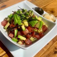 Tuna Poke Bowl · Hawaiian style poke with sesame tuna, cucumber, nori, tamari sauce, and organic brown rice.