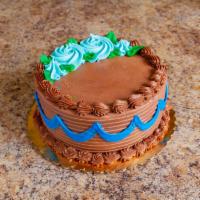 Chocolate Cream Cake · 2 layers of chocolate cake filled with a rich chocolate custard and topped with a chocolate ...