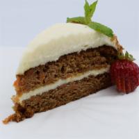 Mad House Carrot Cake · Delicious moist layers of carrot cake with thick and creamy cream cheese frosting.