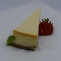 NY Cheesecake · Creamy NY style cheesecake. Served with raspberry and chocolate sauce.