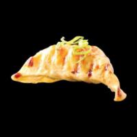 Gyoza · 6 pieces. Chicken pot stickers, served with sweet chili sauce.