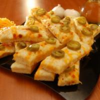 Jalapeno Bread · Ranch covered in mozzarella and cheddar cheese with jalapenos.