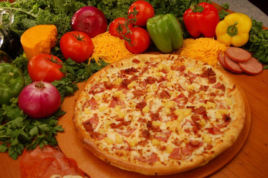 Tropical Delight Pizza · This tropical treat has a delicious combination of Canadian bacon, bacon, and pineapple. It will have you saying ALOHA!