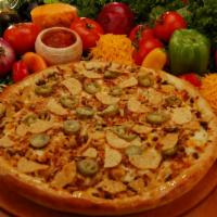 Taco Pizza · One of our specialties is this tasty combination of spicy beef, black olives, cheddar cheese...