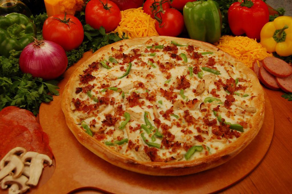 Chicken Bacon Ranch Pizza · Round up a ranch style pizza topped with chicken and bacon on a bed of our creamy ranch dressing, smothered in cheddar and mozzarella cheese.