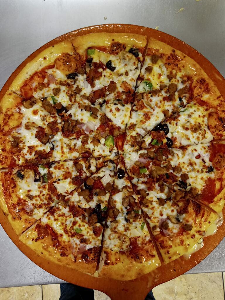 Big 10 · Italian Sausage, Pepperoni, Beef, Canadian Bacon, Sausage, Bacon, Green Peppers, Mushrooms, Black Olives and Onions
