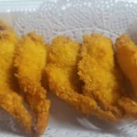 Shrimp Tempura · Deep-fried shrimp coated with tempura batter.