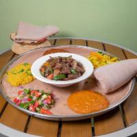 Tibs Lega · Cubed tender beef or lamb, cooked with tomato, jalapeno pepper, and garlic. Lamb.